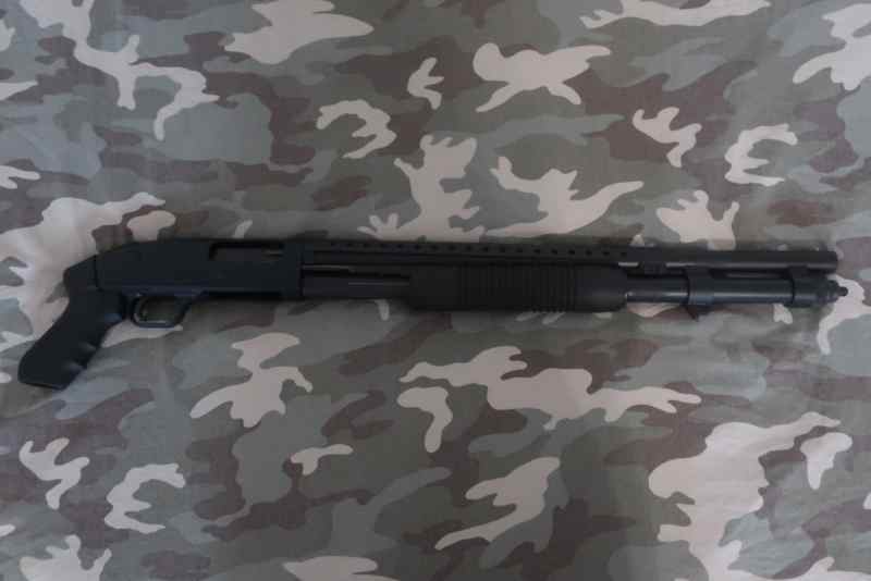 Unfired Mossberg persuader 12 gauge.