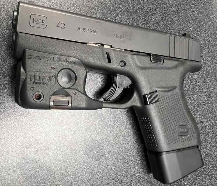 Glock 43 with 2 extended mags and TLR6 Laser/Light